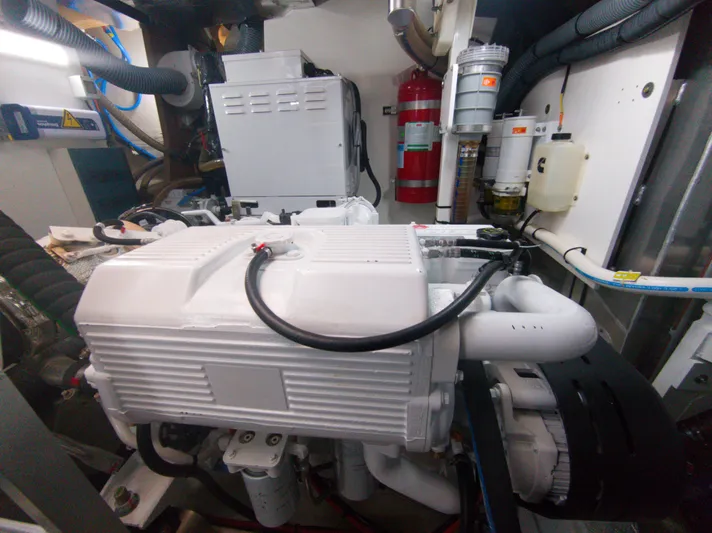  Yacht Photos Pics Engine room of a 2022 Prestige 590 yacht, featuring a clean, organized layout.