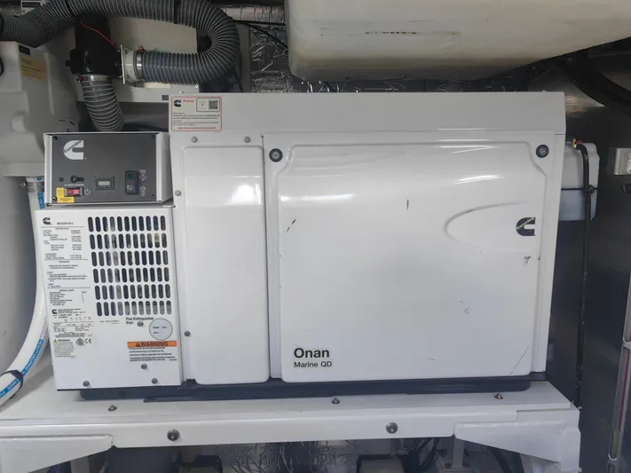  Yacht Photos Pics Cummins Onan Marine QD generator in a 2022 Prestige 590 yacht engine room.