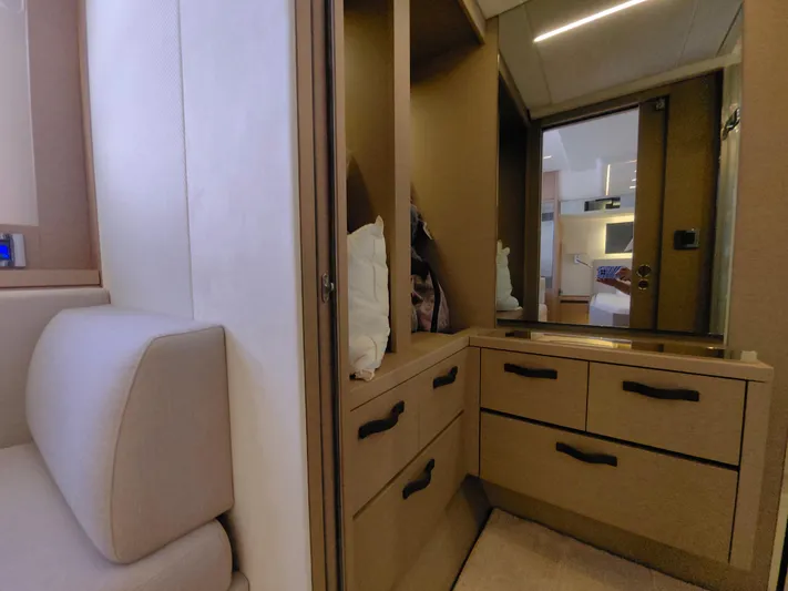  Yacht Photos Pics Luxurious interior of 2022 Prestige 590 yacht with elegant cabinetry and seating.