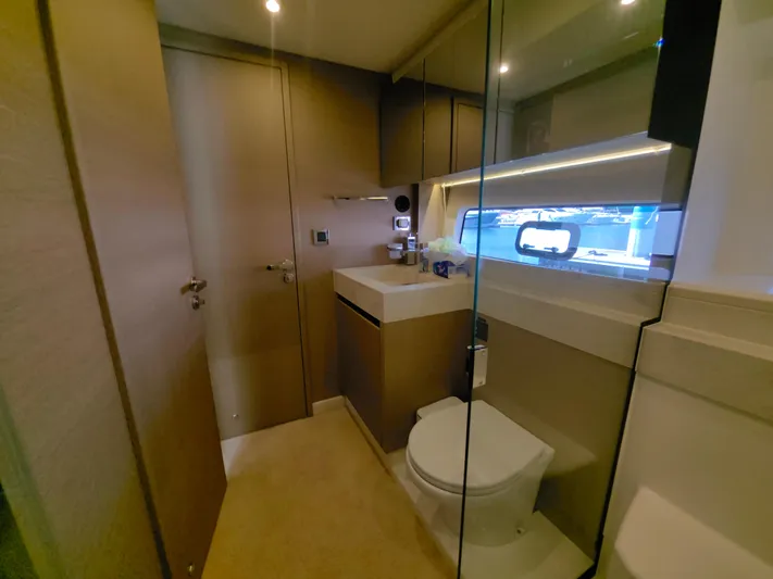  Yacht Photos Pics Luxurious bathroom interior of 2022 Prestige 590 yacht, featuring modern fixtures and elegant design.
