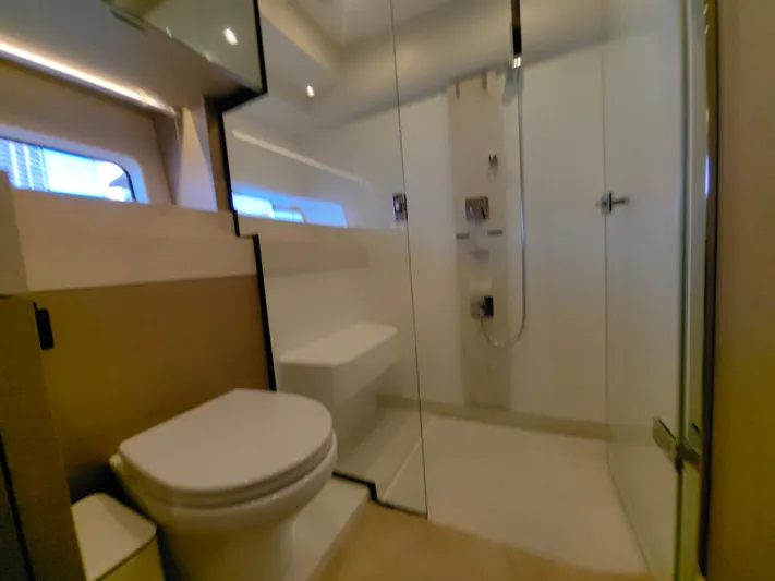  Yacht Photos Pics Luxurious bathroom in 2022 Prestige 590 yacht with modern shower and toilet.