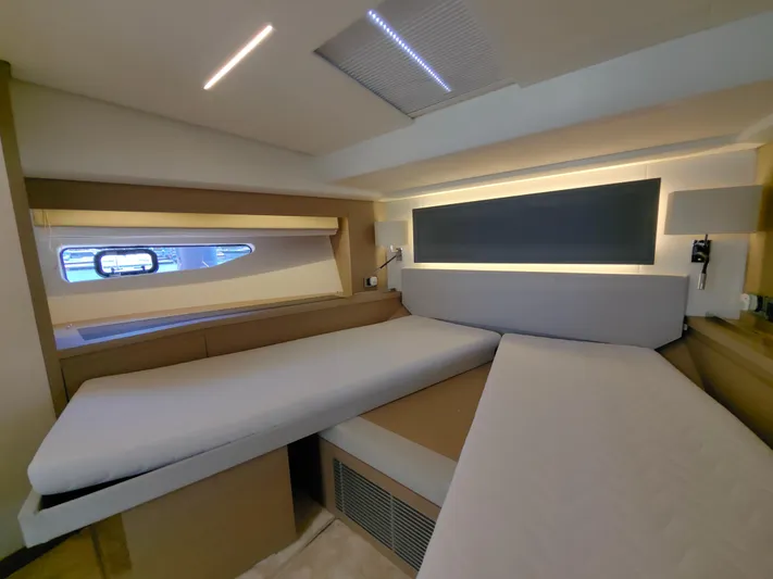  Yacht Photos Pics Luxurious interior of a 2022 Prestige 590 yacht with modern lighting and sleek design.