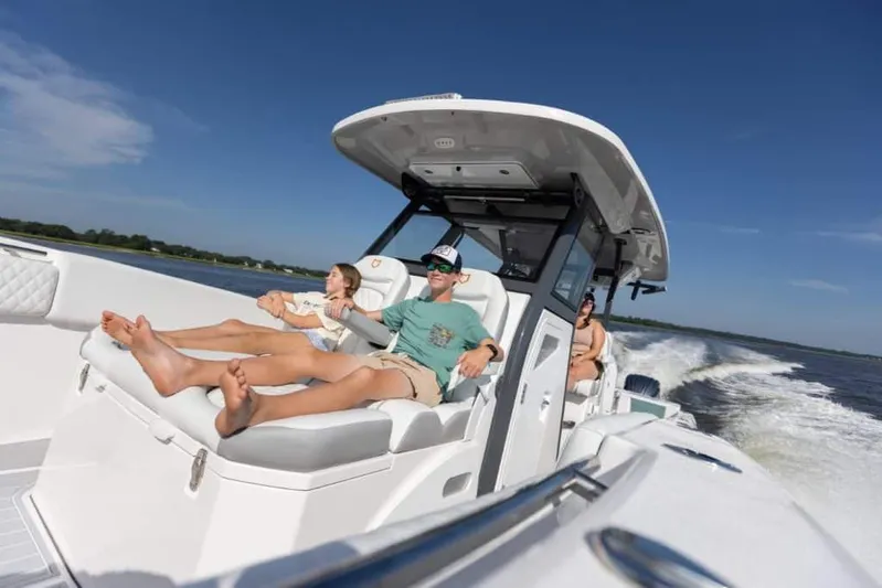 Black Label Marine Group Yacht Photos Pics 2025 Sea Fox 368 Commander Center Console cruising with passengers relaxing.