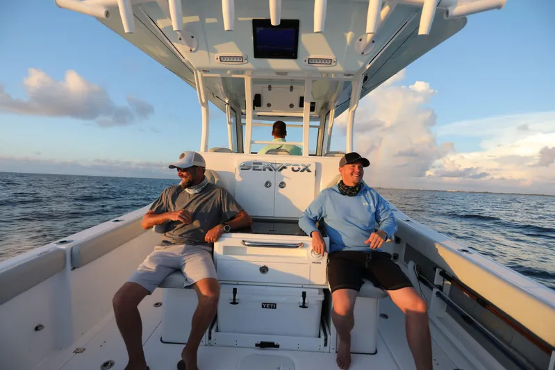 Black Label Marine Group Yacht Photos Pics 2025 Sea Fox 368 Commander Center Console boat with passengers enjoying the ocean view.