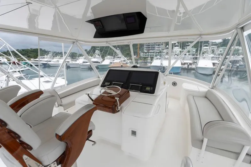 Trailer Trash Yacht Photos Pics Interior of 2021 Viking 58 Convertible yacht with modern helm and luxurious seating.