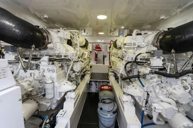 Trailer Trash Yacht Photos Pics Engine room of 2021 Viking 58 Convertible yacht, showcasing dual powerful engines.