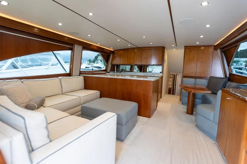 Trailer Trash Yacht Photos Pics Luxurious interior of 2021 Viking 58 Convertible yacht with elegant seating and wood finishes.