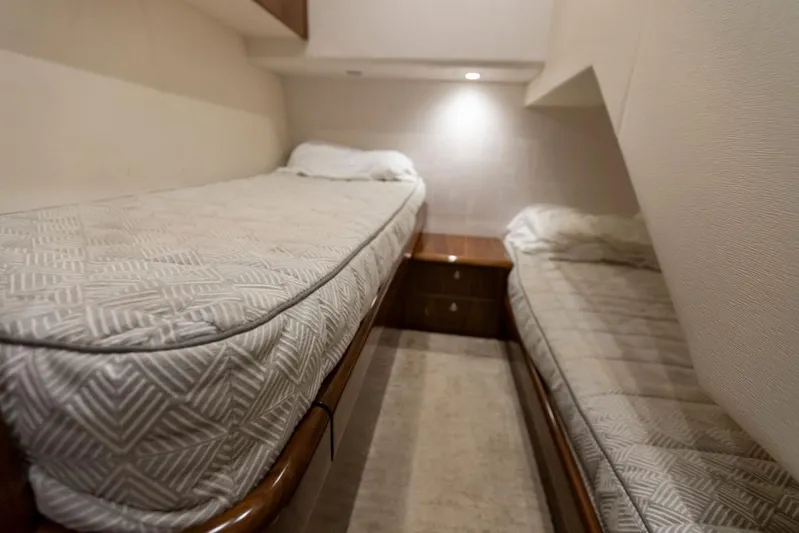 Trailer Trash Yacht Photos Pics Interior cabin of 2021 Viking 58 Convertible yacht with twin beds.