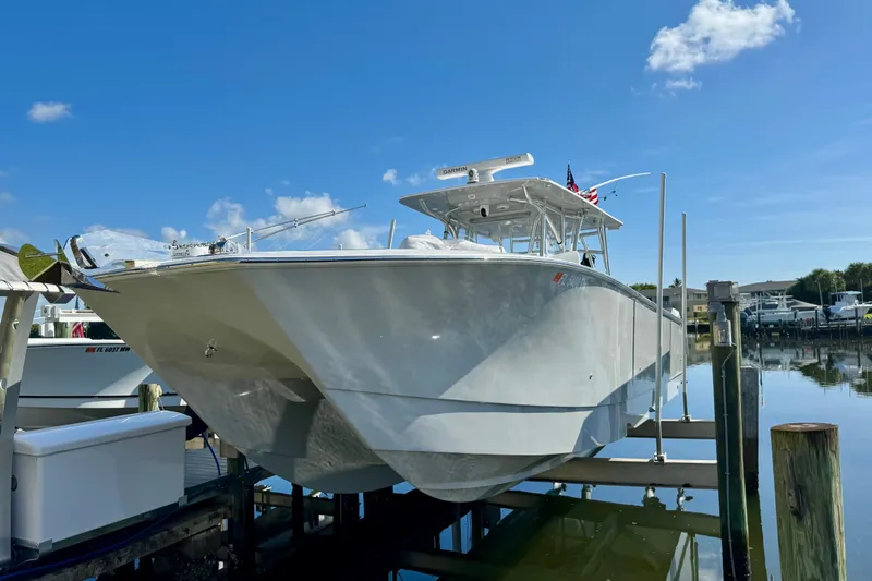 Trade In-- Bring All Offers & Trades Yacht Photos Pics 2021 SeaHunter 41 CTS boat docked under clear blue sky.