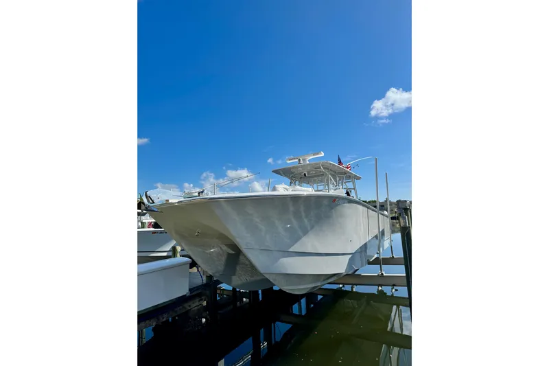 Trade In-- Bring All Offers & Trades Yacht Photos Pics 2021 SeaHunter 41 CTS boat docked under clear blue sky.