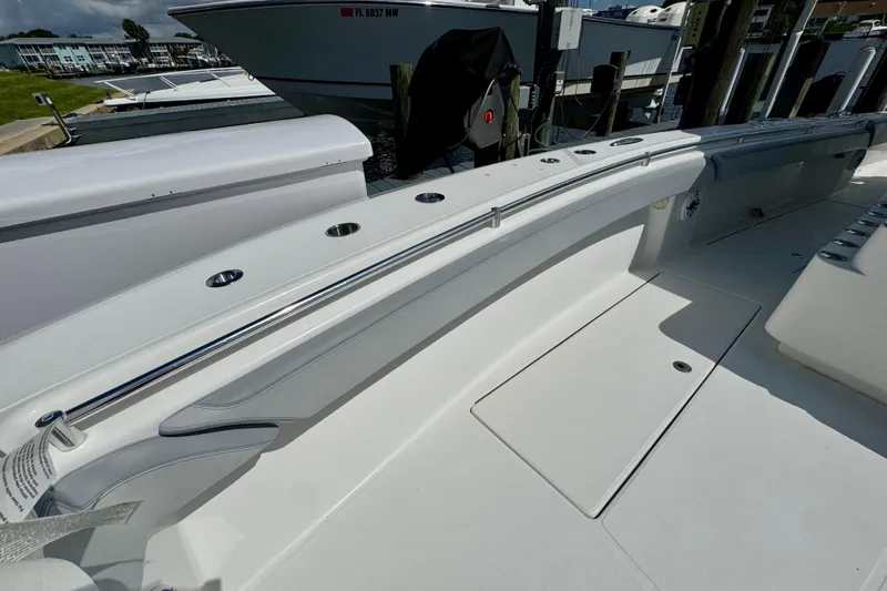 Trade In-- Bring All Offers & Trades Yacht Photos Pics 2021 SeaHunter 41 CTS boat deck with rod holders and storage compartments.