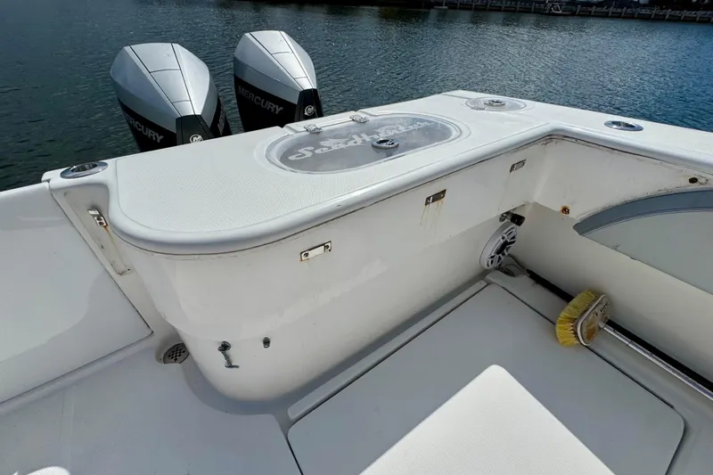 Trade In-- Bring All Offers & Trades Yacht Photos Pics 2021 SeaHunter 41 CTS boat deck with Mercury engines and cleaning brush.