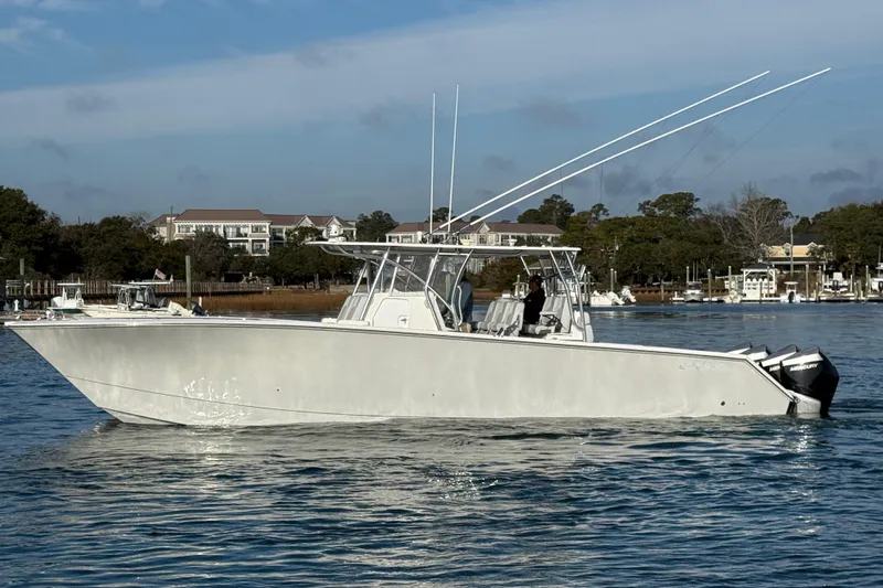 Trade In-- Bring All Offers & Trades Yacht Photos Pics 2021 SeaHunter 41 CTS boat on calm water with scenic background.