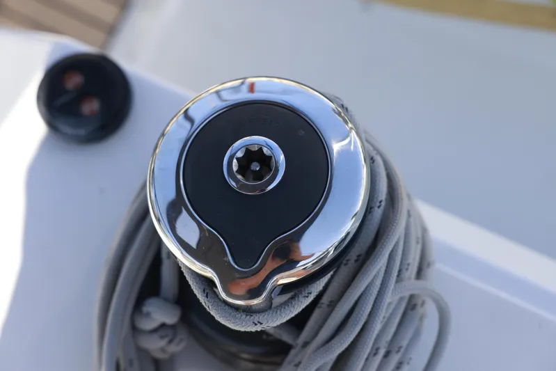 Espiritu Milagro Yacht Photos Pics Winch on Jeanneau Sun Odyssey 410 sailboat, 2022 model, with coiled rope.