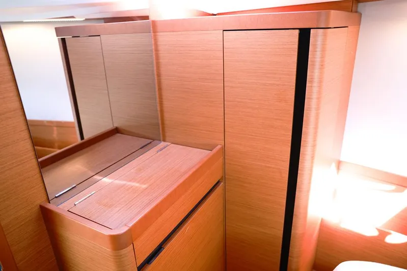 Espiritu Milagro Yacht Photos Pics Interior of 2022 Jeanneau Sun Odyssey 410 yacht, featuring sleek wooden cabinetry.