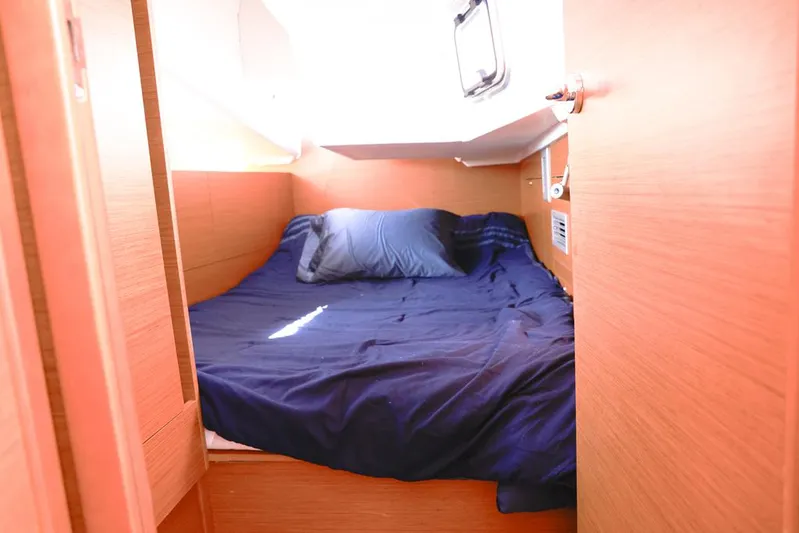 Espiritu Milagro Yacht Photos Pics Cozy cabin interior of 2022 Jeanneau Sun Odyssey 410 with blue bedding.