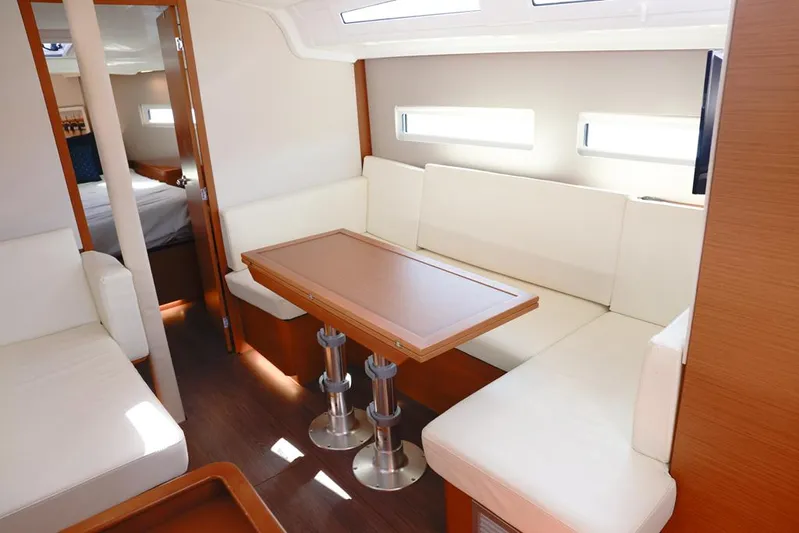 Espiritu Milagro Yacht Photos Pics Interior of 2022 Jeanneau Sun Odyssey 410 yacht with modern seating and table.