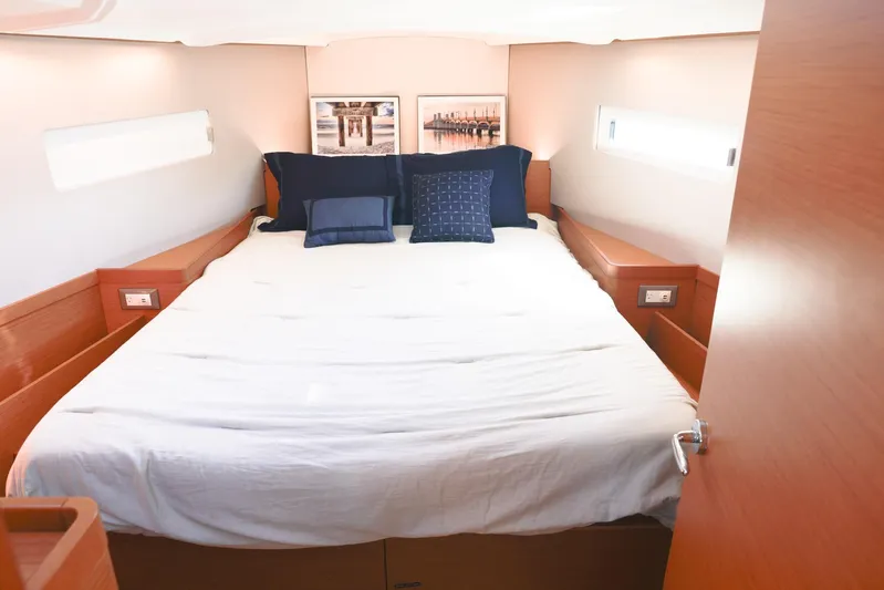 Espiritu Milagro Yacht Photos Pics Luxurious cabin interior of 2022 Jeanneau Sun Odyssey 410 yacht with cozy bedding.