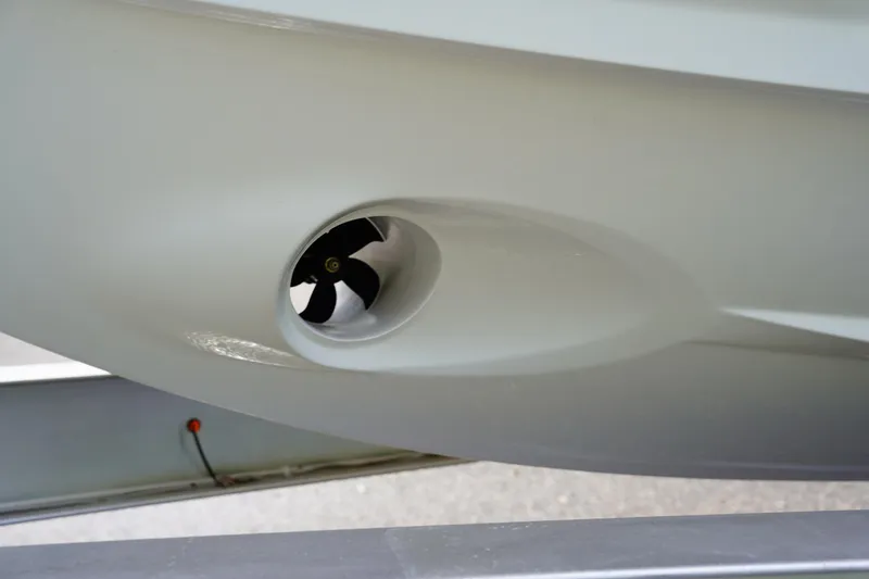  Yacht Photos Pics Close-up of 2023 Blackfin 302 CC boat hull with thruster detail.