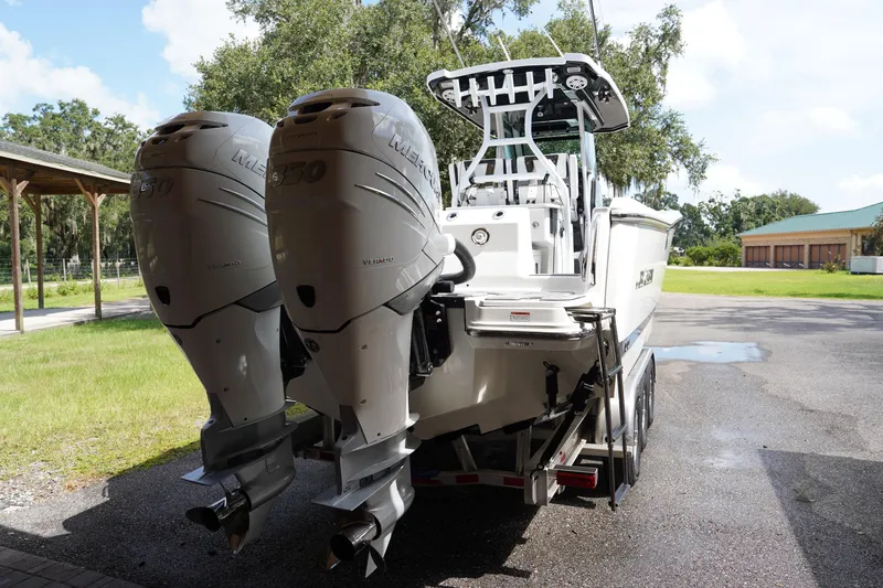  Yacht Photos Pics 2023 Blackfin 302 CC boat with dual Mercury engines on a trailer.