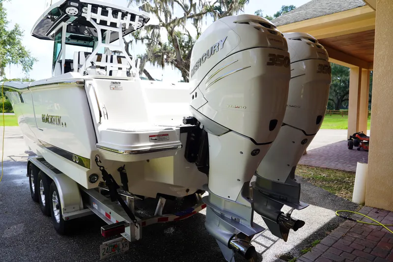  Yacht Photos Pics 2023 Blackfin 302 CC boat with dual Mercury 350 engines on a trailer.