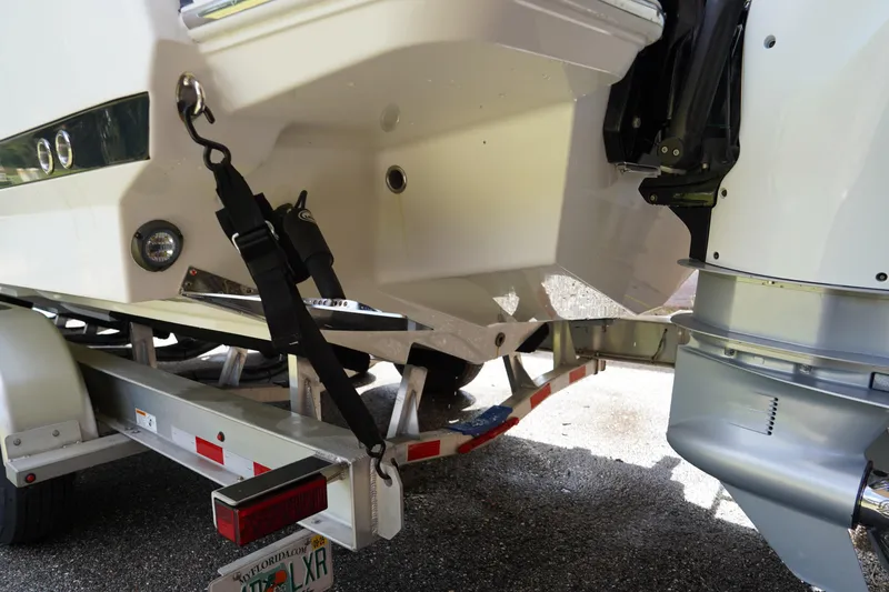  Yacht Photos Pics 2023 Blackfin 302 CC boat on trailer, showing rear view and engine details.