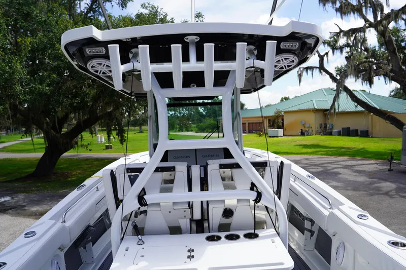  Yacht Photos Pics 2023 Blackfin 302 CC boat interior with advanced navigation equipment and seating.