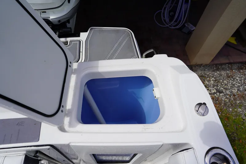  Yacht Photos Pics Open storage compartment on 2023 Blackfin 302 CC boat, featuring a blue interior.
