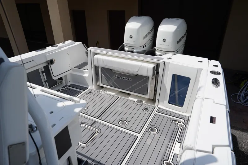  Yacht Photos Pics 2023 Blackfin 302 CC boat deck with dual Mercury engines and sleek design.