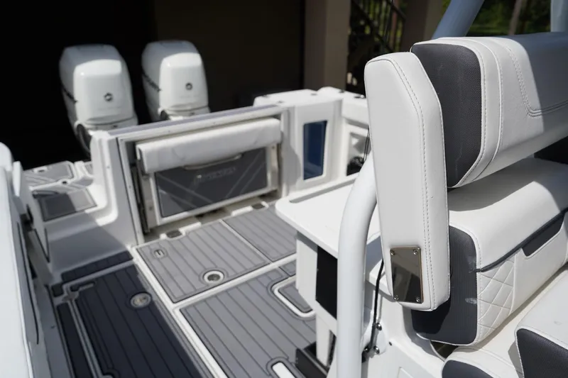  Yacht Photos Pics 2023 Blackfin 302 CC boat interior with dual engines and sleek seating design.