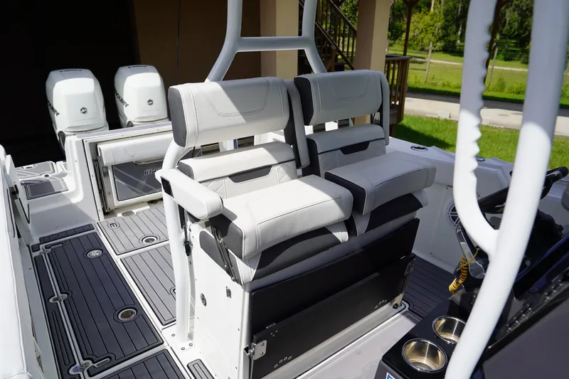  Yacht Photos Pics 2023 Blackfin 302 CC boat interior with dual seats and twin outboard engines.