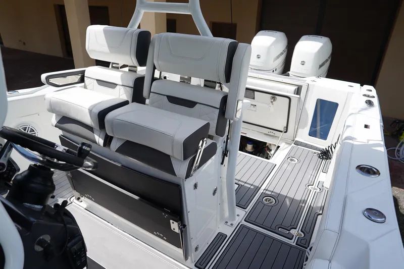  Yacht Photos Pics 2023 Blackfin 302 CC boat interior with dual seats and modern dashboard.
