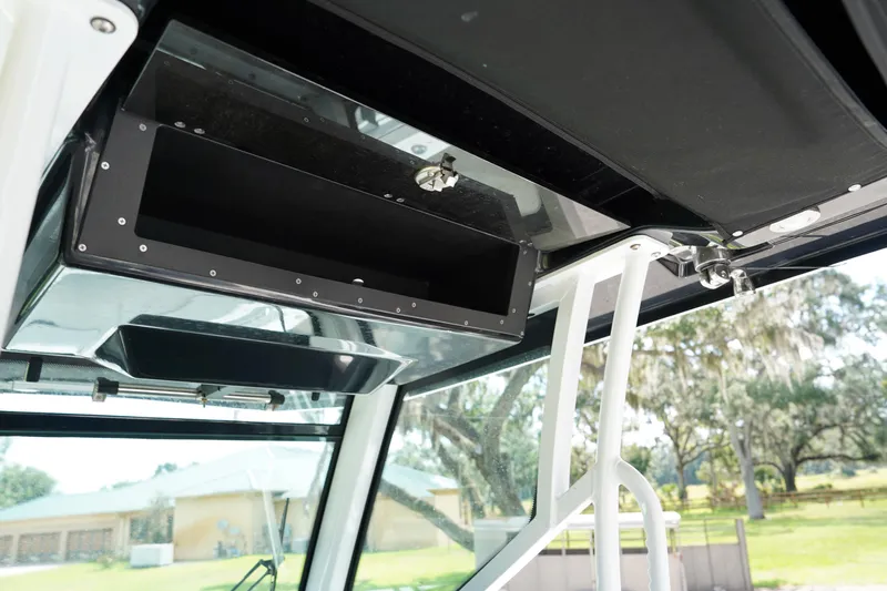  Yacht Photos Pics 2023 Blackfin 302 CC boat interior storage compartment with open hatch.