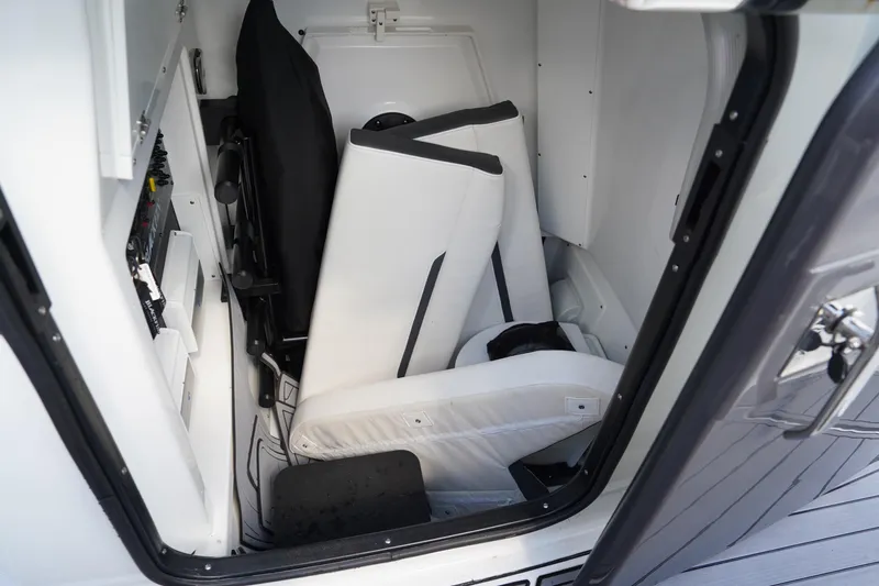  Yacht Photos Pics Storage compartment in 2023 Blackfin 302 CC boat with folded seats and equipment.