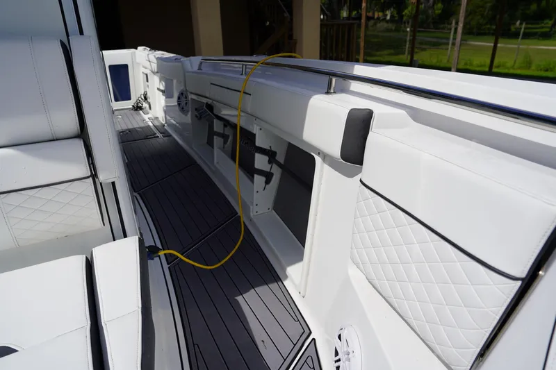  Yacht Photos Pics 2023 Blackfin 302 CC boat interior with white seating and deck details.
