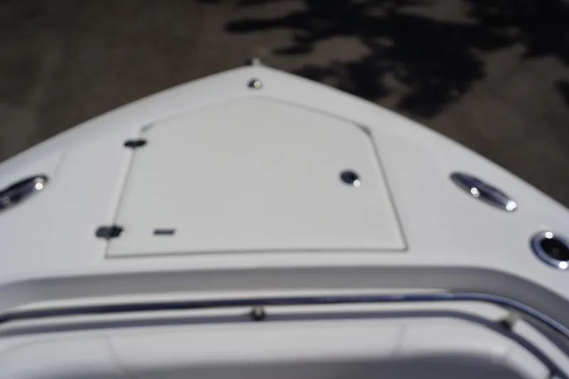  Yacht Photos Pics Bow of 2023 Blackfin 302 CC boat with storage hatch and cleats.