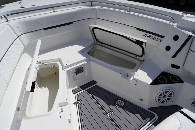  Yacht Photos Pics 2023 Blackfin 302 CC boat interior with open storage compartments and sleek design.