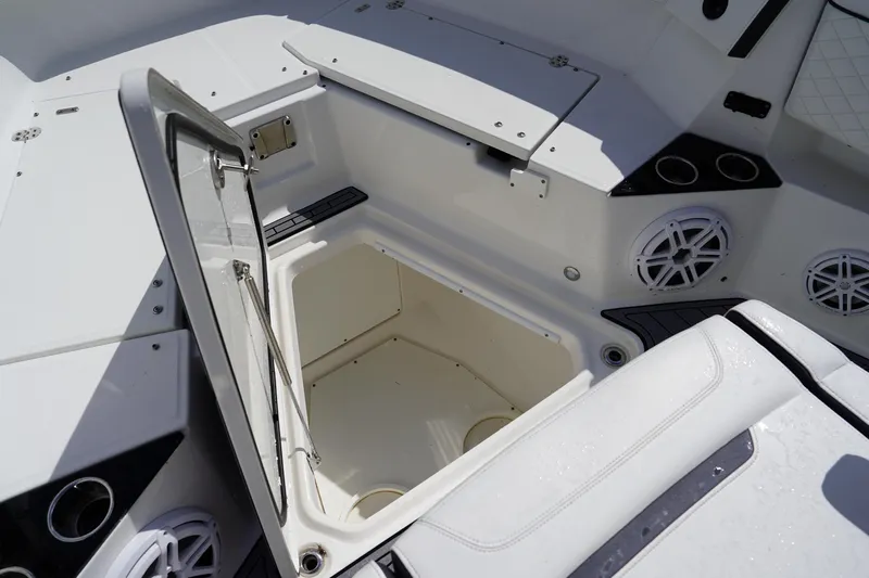  Yacht Photos Pics Open storage compartment on 2023 Blackfin 302 CC boat, featuring sleek white interior design.