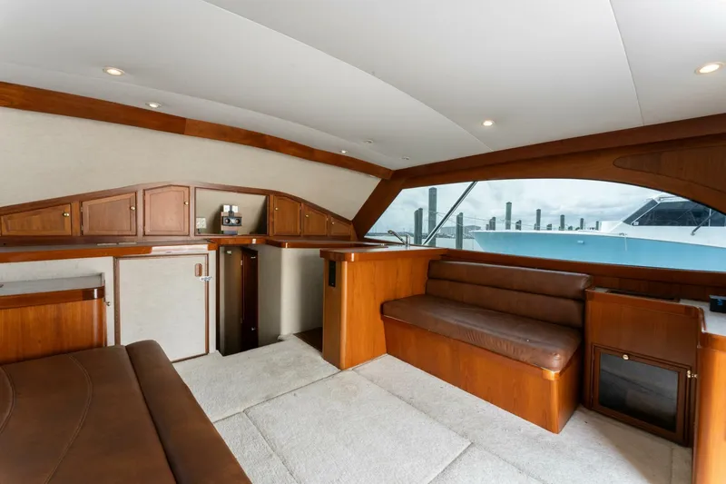 Natural Yacht Photos Pics Interior of 1984 Custom Carolina 41 Ricky Scarborough yacht with wooden cabinetry and leather seating.