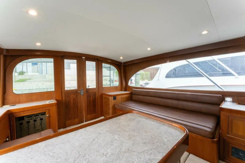 Natural Yacht Photos Pics Interior of 1984 Custom Carolina 41 Ricky Scarborough boat with wooden finishes and leather seating.