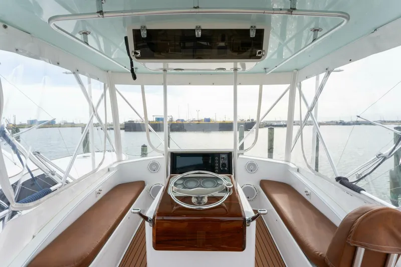 Natural Yacht Photos Pics 1984 Custom Carolina 41 Ricky Scarborough boat helm with leather seats and panoramic view.