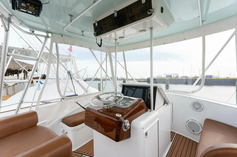 Natural Yacht Photos Pics 1984 Custom Carolina 41 Ricky Scarborough boat helm with modern navigation equipment.