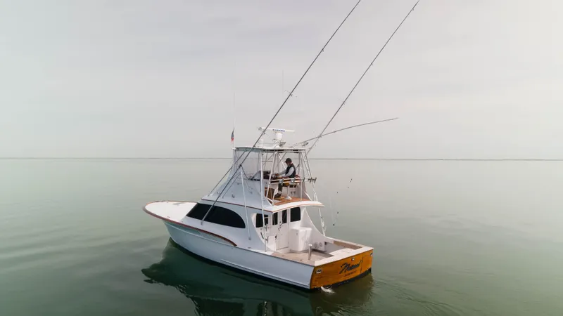 Natural Yacht Photos Pics 1984 Custom Carolina 41 Ricky Scarborough boat on calm water.