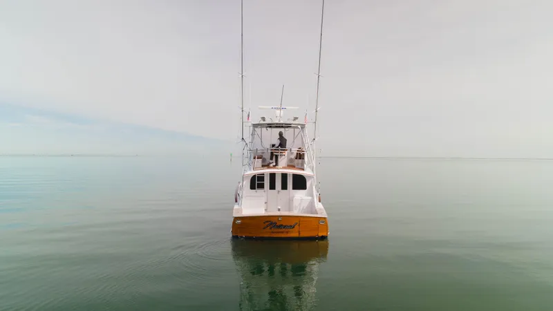 Natural Yacht Photos Pics 1984 Custom Carolina 41 Ricky Scarborough boat on calm water.