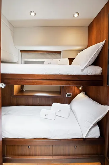 Infinito Yacht Photos Pics Luxurious wooden bunk beds in 2007 Sunseeker Predator 82 yacht cabin.