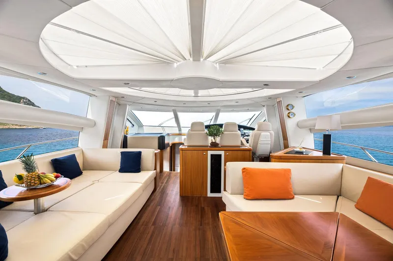 Infinito Yacht Photos Pics Luxurious interior of 2007 Sunseeker Predator 82 yacht with elegant seating and ocean view.