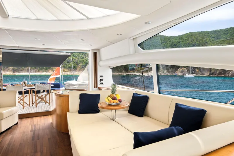 Infinito Yacht Photos Pics Luxurious interior of 2007 Sunseeker Predator 82 yacht with ocean view and elegant seating.