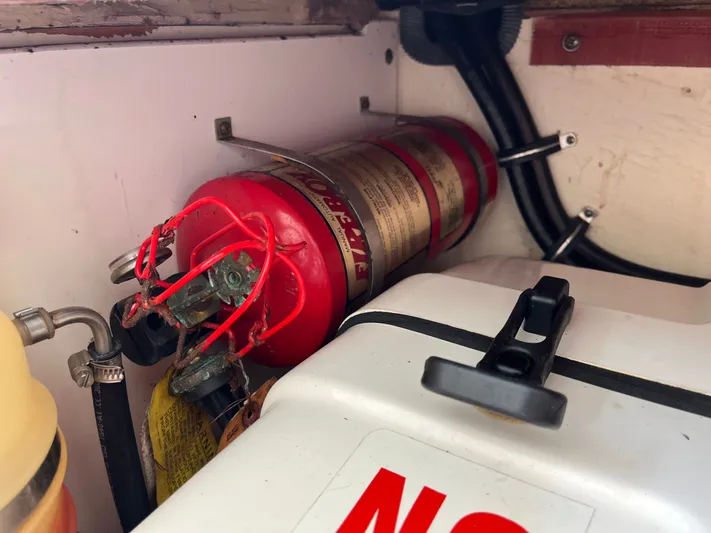  Yacht Photos Pics Fire extinguisher in 2010 Pursuit OS 345 Offshore boat compartment.