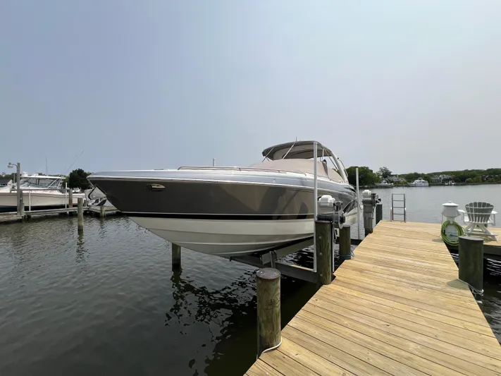 4th Quarter Yacht Photos Pics 2016 Formula 310 Bowrider docked on a sunny day, showcasing sleek design and luxury.
