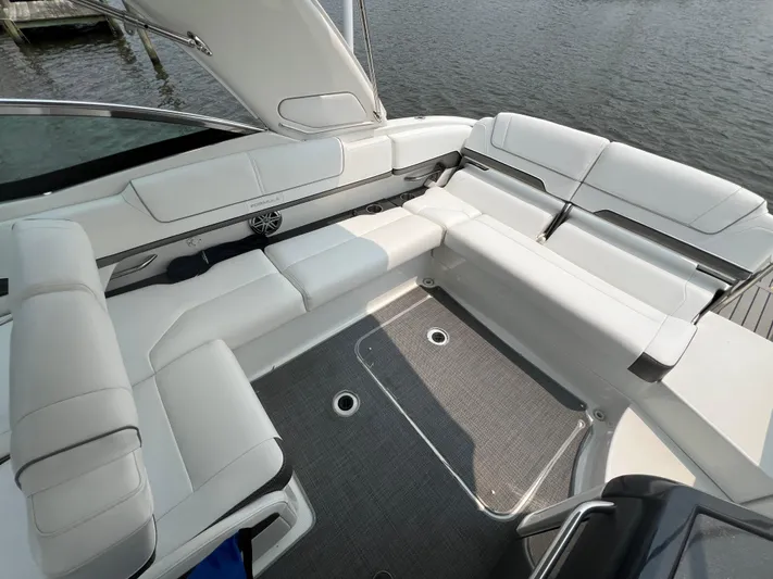 4th Quarter Yacht Photos Pics 2016 Formula 310 Bowrider with spacious white seating and sleek design on the water.